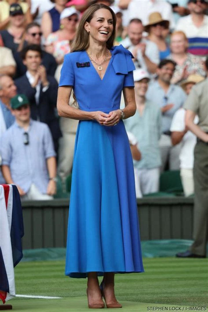 As always, the impeccable Kate Middleton in a coral coat dress receives guests in the garden of Buckingham Palace