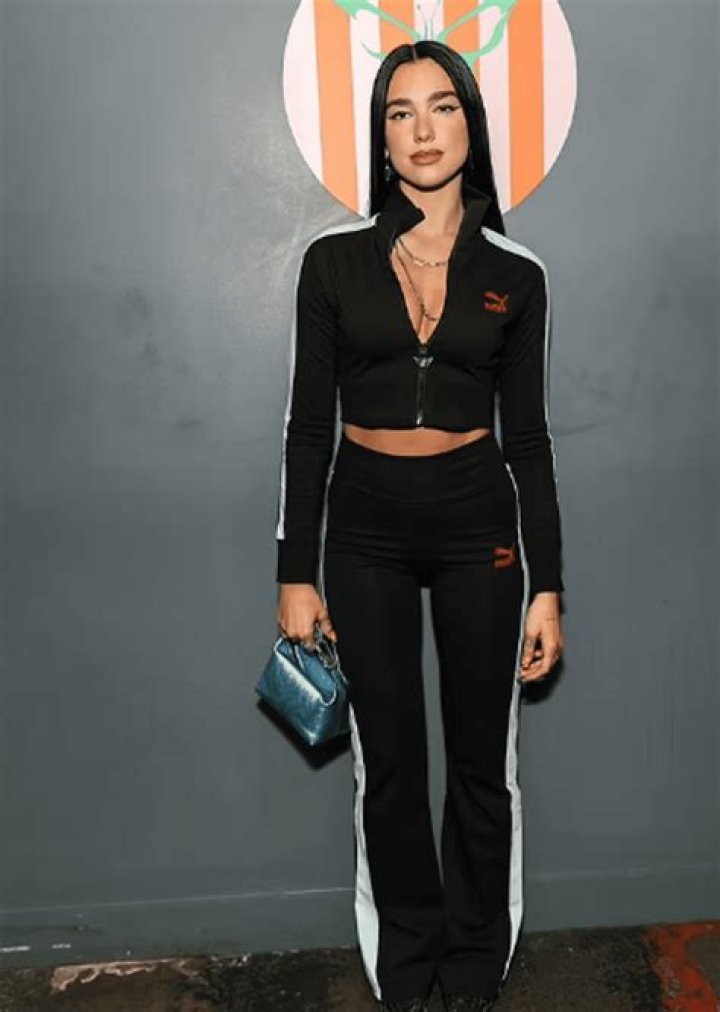 Black Cropped Tracksuit-Clad Dua Lipa Shows Her Abs During The London Premiere Of Her New PUMA Line