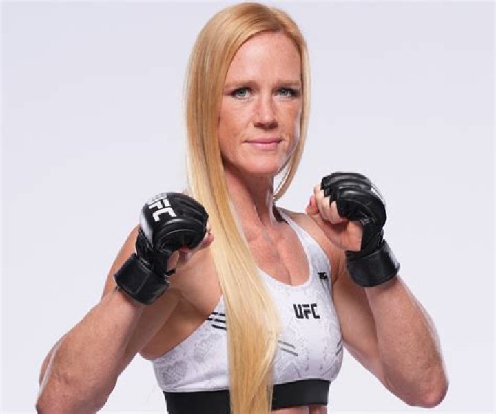 Holly Holm In Workout Gear Is “Broken-Hearted But Never Broken”