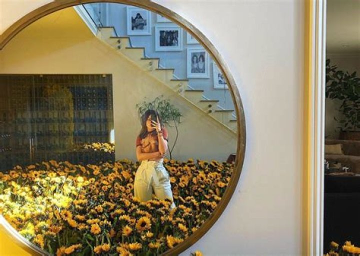Kylie Jenner Poses In A Room Full Of Sunflowers — Did Travis Scott Give Them To Her?