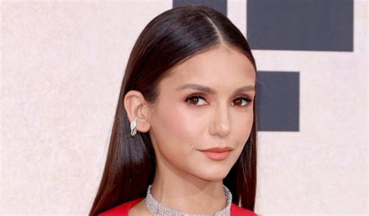 Nina Dobrev in Bathing Suit Puts 