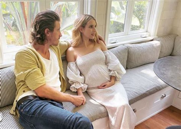 Pregnant Emma Roberts Shows Off Her Baby Bump In Pink Mini Dress