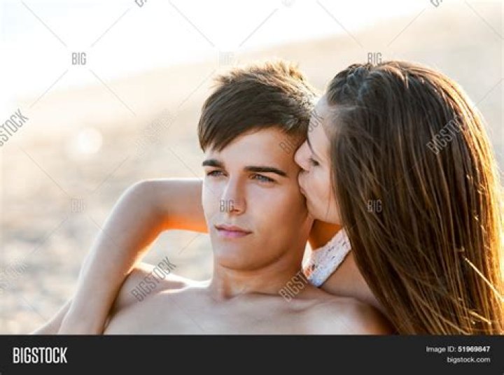 Prince Charles kissed by a Playboy model on an Australian beach