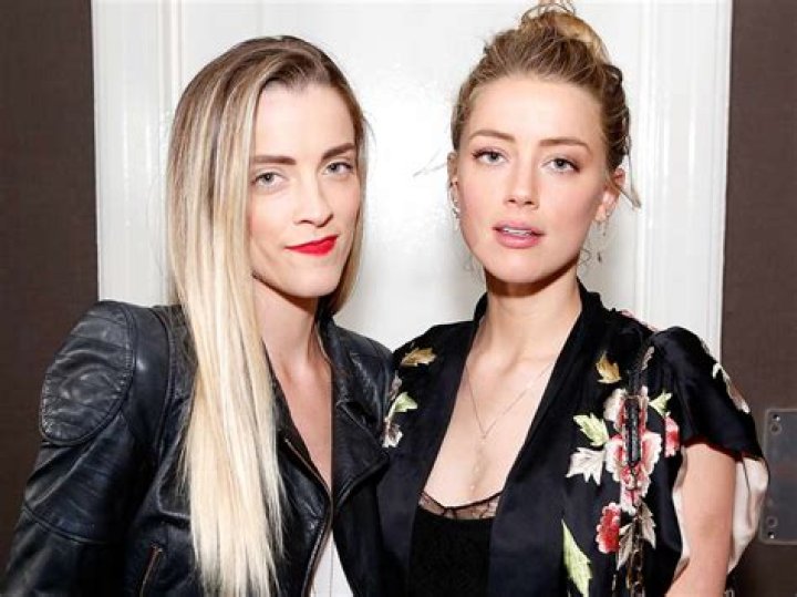 How old is Amber Heard's sister?