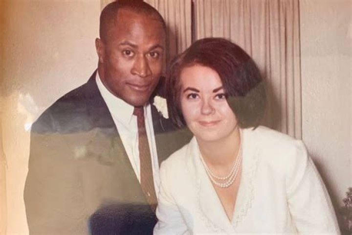 Who is his John Amos wife Noel J. Mickelson?